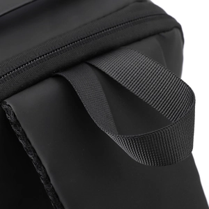 Close-up of durable black nylon fabric with reinforced stitching and zipper detail