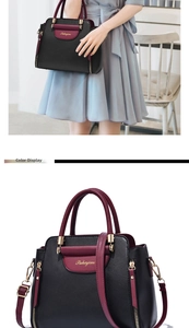 Detail of elegant black and burgundy leather handbag with golden logo and side zipper