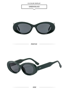Detail view of oval vintage green sunglasses with grey lenses and diamond studs