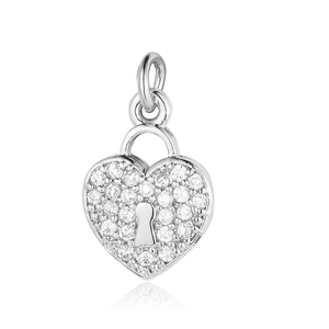 Macro detail of silver heart lock pendant with clear cubic zirconia inlay and top ring