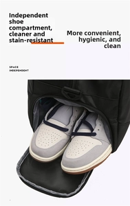 Close-up of the dedicated shoe compartment on a black waterproof gym and travel duffel bag