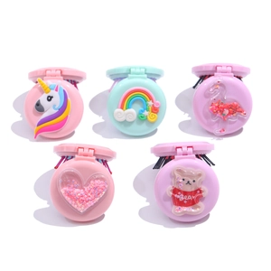 Collection of five colorful foldable hairbrushes with cute cartoon charms and mirrors