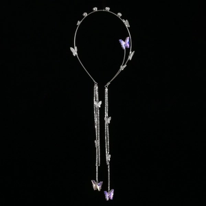 Detail of silver headband featuring purple butterflies and sparkling rhinestone tassels