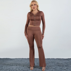 Women's 2-piece coffee brown track suit with zip hoodie and flared pants on model