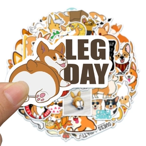 Close-up of waterproof cartoon Corgi butt sticker with Leg Day text for laptop decoration