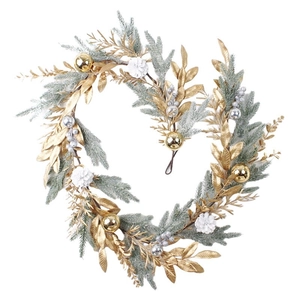 Christmas wreath with golden leaves, snow-covered pine branches and decorative balls