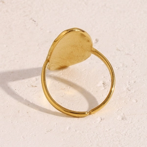 Macro detail of 18K gold-plated stainless steel ring with smooth inner surface and band