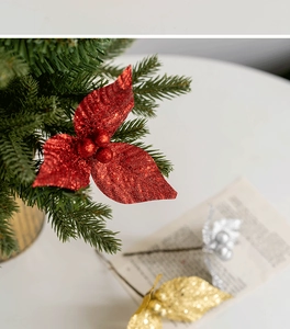 Detail of red Christmas tree spray with glitter berries and festive foliage accents