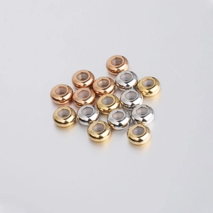 Detailed view of 8mm stainless steel positioning beads with silicone inserts in three colors