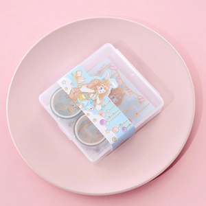 Close-up of cute anime style washi tape set in a transparent storage box for DIY journaling