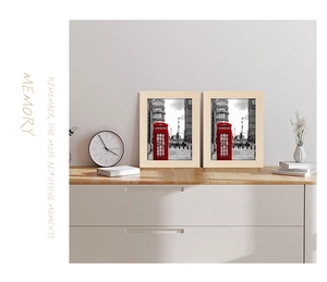 Set of two light wood photo frames featuring London street art for home wall decor