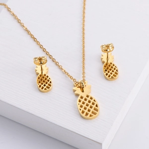 Golden pineapple titanium steel jewelry set featuring a mesh hollow necklace and stud earrings