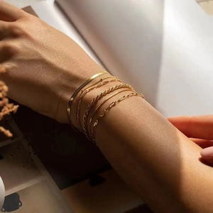 Gold stainless steel bracelet set with snake, figaro and paperclip link chains