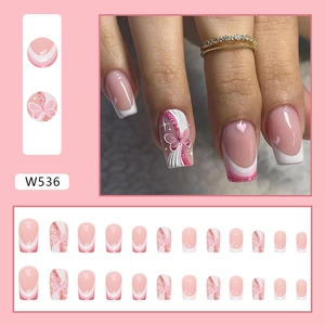 Pink glitter butterfly and heart press-on nails with white French tips, medium square shape