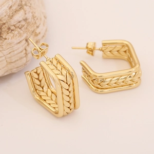 Golden woven heart earrings in square U-shape with intricate metallic texture and studs