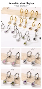 Detailed tile display of pear-cut zircon teardrop earrings in multiple colors on wooden stand