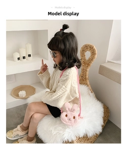 Detail of pink plush bunny crossbody bag for kids with soft fur and shoulder strap
