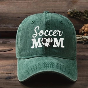 Close-up of Soccer MOM embroidery on a green washed cotton vintage baseball cap