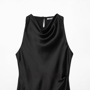 Elegant black satin sleeveless blouse with a draped cowl neck and smooth glossy finish