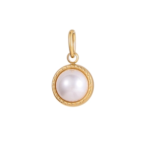 Detail of round white gemstone pendant with golden spiral textured stainless steel border