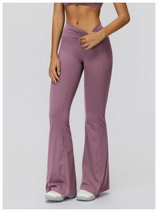 Detail of high waisted cross waist yoga pants with purple flare design for women