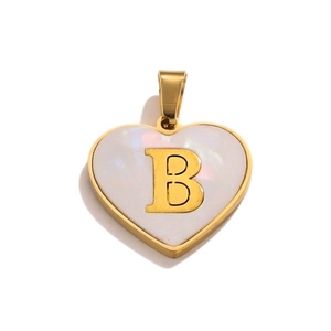 Detailed close-up of a heart pendant with gold letter B and white pearlescent inlay