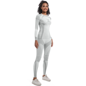 Detail of seamless knit white sport set showing compression texture and slim fit design