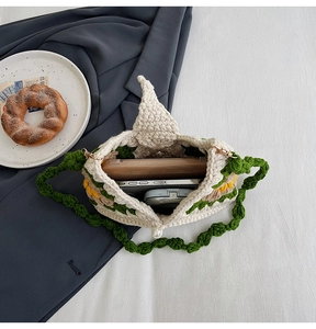 Interior view of large crochet sunflower tote bag showing phone and wallet storage