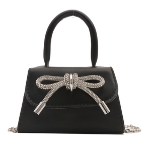Minimalist black mini shoulder bag with large silver rhinestone bow and chain strap