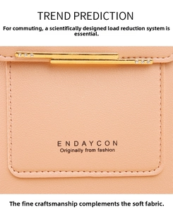 Macro view of peach lychee leather texture with gold diamond-set metal hardware detail