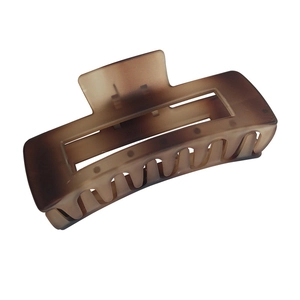Large matte amber brown shark hair claw clip with a square hollow design for women