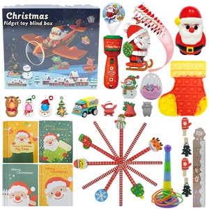 Detailed flat lay of Christmas countdown blind box with diverse fidget toys and cards