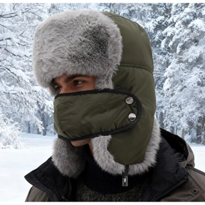 Winter trapper hat with gray faux fur and matching face mask worn in a snowy forest