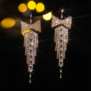 Detailed view of luxury rhinestone butterfly tassel earrings with sparkling zircon fringes