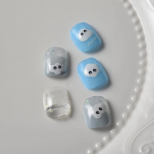 Detail of 3D cartoon cloud nail stickers on square round blue and grey press-on nails