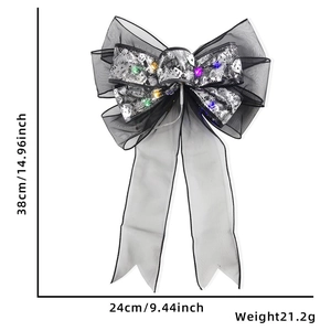Detail view of 38x24cm Halloween mesh bow with LED lights and silver skull print