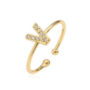 Close-up of a gold-plated open ring featuring a sparkling zircon-studded letter V design