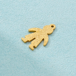 Frosted gold stainless steel boy shaped pendant accessory on a light blue textured surface