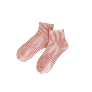 Breathable pink cotton ankle socks with elastic ribbed cuffs for women on white background