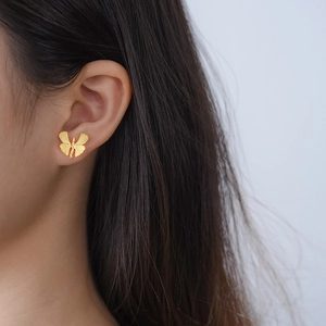 Creative S925 silver ginkgo butterfly stud earrings with matte gold finish on model