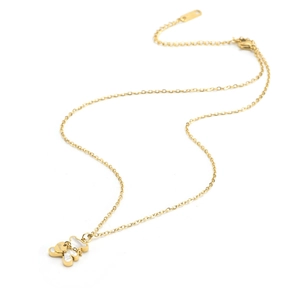Golden bear pendant necklace with white inlay and Love engraving on white background