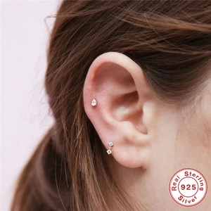 925 silver ear piercing set with teardrop gemstone and double zircon studs on model