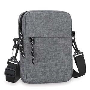 Minimalist grey fabric crossbody shoulder bag with adjustable strap and front zipper pocket