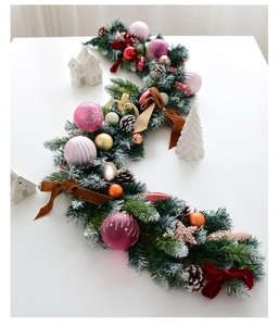 Close-up of 135cm Christmas garland with pink ornaments, pine cones and velvet bows