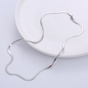 3mm flat stainless steel snake chain necklace with lobster clasp on white tray