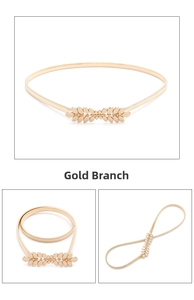 Detailed view of elegant golden leaf buckle design on adjustable elastic dress belt