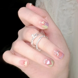 Short purple French manicure press-on nails with glitter hearts and silver pearl rings