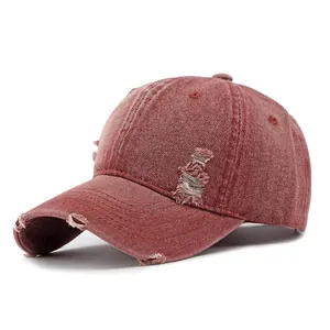 Vintage washed brick red denim baseball cap with distressed rip details for women