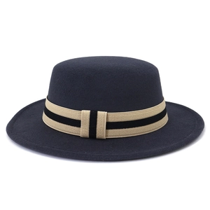 Dark grey flat top wool boater hat with a striped ribbon band and wide flat brim