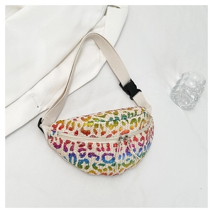 Detailed view of straw woven waist bag with rainbow leopard print and adjustable buckle